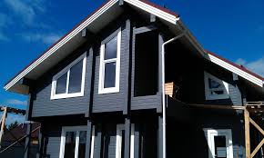 Чем покрасить фасад деревянного дома – красота и практичность