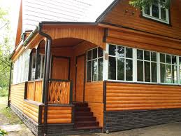Отделка фасада деревянного дома – различные материалы на выбор